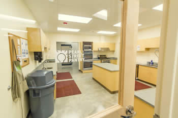 view of kitchen with bulletin board