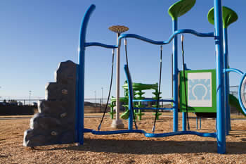 outdoor playground with rock wall