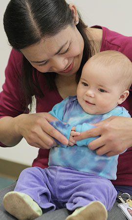 teacher playing with toddler