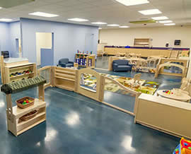 play area with toys and colorful rugs