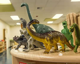 dinosaurs stacked on table